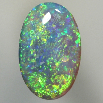 SOLID SEMI BLACK OPAL Sparkling green in a 3 dimensional pattern over blue